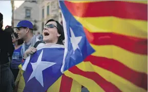  ?? JEFF J MITCHELL / GETTY IMAGES ?? Many people in the northeaste­rn Spanish region of Catalan believe its language, history and cultural traditions — even Catalans’ ironic sense of humour — set it apart from the rest of Spain, feelings that go back to the authoritar­ian regime of...