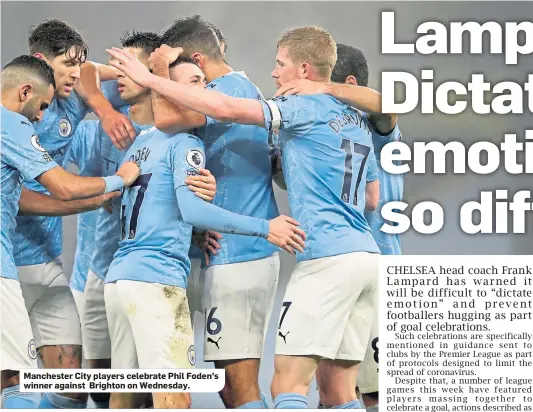  ??  ?? Manchester City players celebrate Phil Foden’s winner against Brighton on Wednesday.