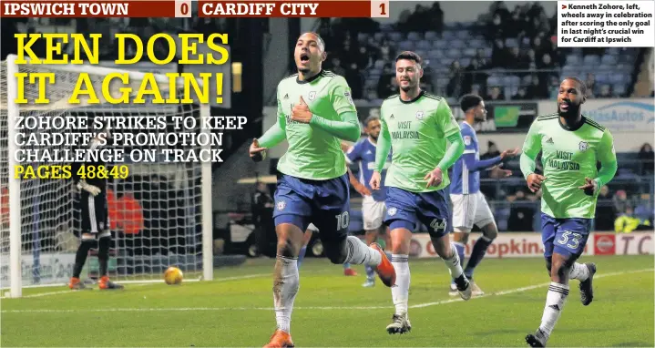  ??  ?? > Kenneth Zohore, left, wheels away in celebratio­n after scoring the only goal in last night’s crucial win for Cardiff at Ipswich