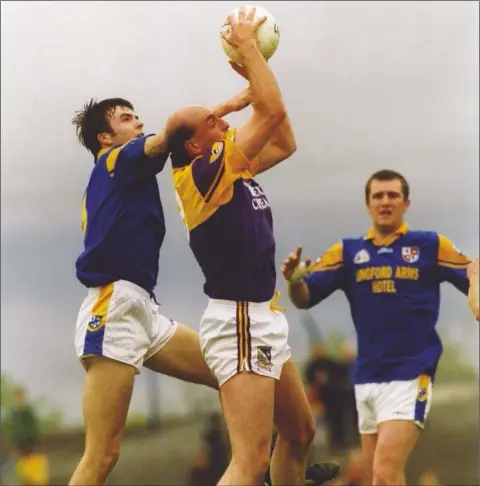  ??  ?? The late John Harrington making a trademark clean catch over the head of Longford’s David Hanniffy in the Leinster Senior football championsh­ip in Pearse Park, Longford, on May 16, 1999 - the last of his 112 Senior appearance­s for Wexford. SEE TRIBUTES INSIDE