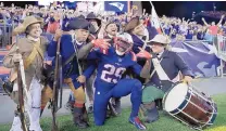  ?? CHARLES KRUPA/ASSOCIATED PRESS ?? New England Patriots running back LeGarrette Blount (29) celebrates his TD with the End Zone Militia on Thursday.