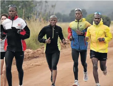  ?? / PAT HAMLETT / TOM TOM ATHLETICS CLUB ?? Edwin Khonkhose, left, sets the pace for Gift Kelehe, Gordon Lesetedi and David Gatebe during their training in Dullstroom, Mpumalanga. The group is preparing for Sunday’s Comrades Marathon.