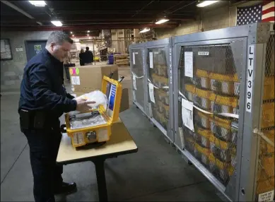  ?? MARK LENNIHAN-ASSOCIATED PRESS ?? In this March 24file photo, Vincent Dellova, a coordinato­r at the New York City Emergency Management Warehouse, packs up a ventilator, part of a shipment of 400, in New York. New York and New Jersey, early hot spots during the COVID-19 pandemic, have so far declined to release detailed breakdowns of their spending on personal protective gear and medical equipment during the first frenzied months of the virus outbreak.