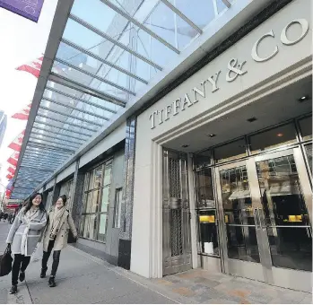  ?? MARK VAN MANEN/FILES ?? Alberni Street and nearby Robson have become a magnet for high-end internatio­nal retailers such as American jeweller Tiffany’s, above, Muji from Japan and Bailey Nelson from Australia.
