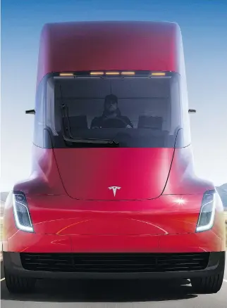  ?? TESLA VIA AP ?? Tesla introduced its futuristic electric semi truck last Thursday, but didn’t disclose the price of the truck that is set to go into production in 2019, nor did it say how much the truck weighs. The missing informatio­n are key factors for a commercial...