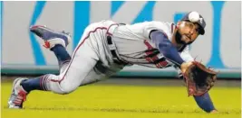  ??  ?? Atlanta Braves right fielder Nick Markakis can’t get to a ball hit by Washington’s Michael Taylor in Game 2. Taylor had a double on the play.