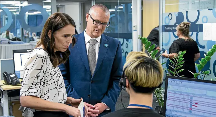  ?? CHRIS MCKEEN/STUFF ?? Prime Minister Jacinda Ardern and Health Minister David Clark visit the Healthline call centre in Auckland last month after the first confirmed case of a patient with coronaviru­s was admitted to Auckland Hospital.