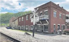  ?? John Raby, The Associated Press ?? A former corner post office is pictured May 12 in Matewan, W.VA. In 1920, 10 people were killed in a gun battle between miners and private security guards hired to evict them for joining a union in what is called the Matewan Massacre.