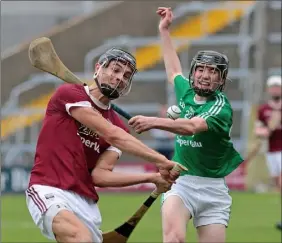  ??  ?? Jack O’Connor (St. Martin’s) striking despite the presence of Charlie McGuckin (Naomh Eanna) in the 2017 semi-final.