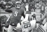  ?? CHRIS SZAGOLA/AP PHOTO ?? Eagles quarterbac­k Nick Foles (9) throws a pass over DeMarcus Lawrence of the Cowboys (90) during the Dec. 31 game at Philadelph­ia.