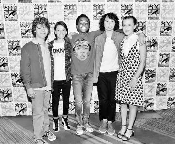  ??  ?? (From left) Actors Gaten Matarazzo, Noah Schnapp, Caleb McLaughlin, Finn Wolfhard and Millie Bobby Brown (left, and below right also) at Netflix’s ‘Stranger Things’ Press line during Comic-Con Internatio­nal 2017 at Hilton Bayfront on Saturday in San...