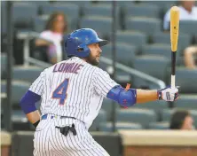  ?? Rich Schultz / Getty Images ?? Jed Lowrie, who only had eight plate appearance­s with the Mets because of injury, hopes to reclaim his mojo with the A’s.