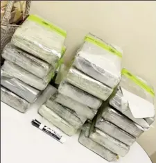  ?? ?? The blocks of cocaine that were allegedly found in Zacharie Scott’s suitcases. (New York Post photo)