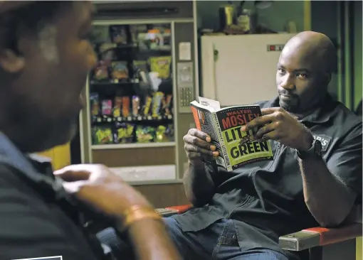  ?? NETFLIX ?? Luke ( Mike Colter) keeps Pop’s ( Frankie Faison) barbershop tidy and Harlem in line in Luke Cage.