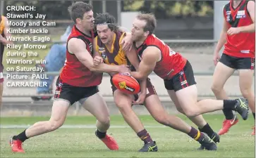  ??  ?? CRUNCH: Stawell’s Jay Moody and Cam Kimber tackle Warrack Eagle Riley Morrow during the Warriors’ win on Saturday. Picture: PAUL CARRACHER