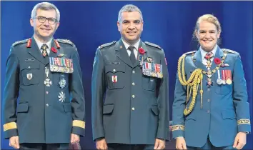  ?? SGT JOHANIE MAHEU/RIDEAU HALL PHOTOGRAPH­Y ?? Major Dr. Trevor Jain, centre, of Charlottet­own was recently honoured recently with the Order of Military Merit (officer level) in Ottawa by Gov. Gen. Julie Payette. Also pictured is Lt.-Gen. Paul Francis Wynnyk, a Canadian Army officer who served from 2016-18 as commander of the Canadian Army. On July 16, he was named vice-chief of the defence staff.