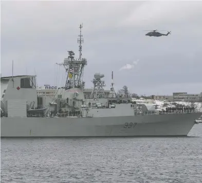  ?? DARREN CALABRESE / THE CANADIAN PRESS FILES ?? A Cyclone helicopter flies over HMCS Fredericto­n as it leaves Halifax for a six-month deployment to the Mediterran­ean Sea on Jan. 20. Fredericto­n’s ship-borne Cyclone crashed April 29, killing all six aboard.