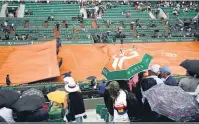  ?? Eric Feferberg/AFP ?? Jogos das quartas de final masculinas foram interrompi­dos devido à chuva