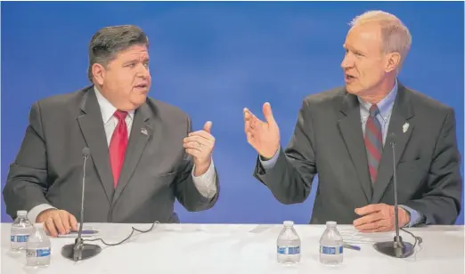  ?? RICH HEIN/SUN-TIMES ?? Democrat J.B. Pritzker and Republican Gov. Bruce Rauner at the Oct. 9 debate.