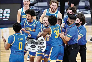  ?? AJ MAST / AP ?? UCLA players celebrate after beating Alabama 88-78 in overtime of a Sweet 16 game in the NCAA men’s college basketball tournament at Hinkle Fieldhouse in Indianapol­is Sunday.