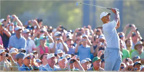  ?? UPI-Yonhap ?? Tiger Woods hits off the 12th tee during a practice round prior to the Masters golf tournament at the Augusta National Golf Club, in Augusta, Georgia, U.S., Tuesday.