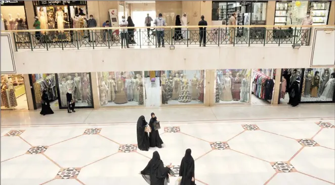  ?? Photo by Mohammad Morsi ?? Some of the women in a mall shopping for Eid Al-Adha Festival which is to be celebrated on Friday.