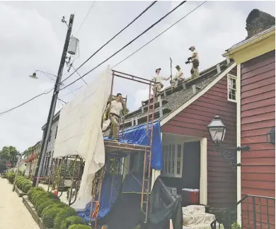  ?? BY JOHN MCCASLIN ?? A new more historical­ly accurate roof for the historic Mayor's House in Washington.