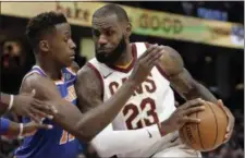  ?? TONY DEJAK — THE ASSOCIATED PRESS ?? LeBron James drives past the Knicks’ Frank Ntilikina in the first half on Oct. 29 at Quicken Loans Arena.