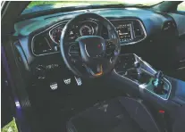  ?? PHOTOS: CHRIS BALCERaK/DRIVING ?? Chrysler keeps making the Dodge Challenger stronger and meaner, Brian Harper says.