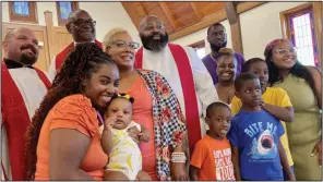  ?? (Arkansas Democrat-Gazette/Frank E. Lockwood) ?? Randall Lewis of Little Rock (center, with beard) and his wife, Kim, pose for photos with family members and his fellow clergy members on June 19 after being ordained as a Minister of Word and Sacrament in the Lutheran Church — Missouri Synod. The service was held at Grace Lutheran Church.