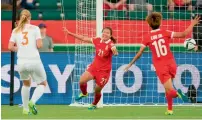  ?? — AFP ?? China’s Wang Lisi (21) celebrates her goal.