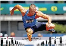  ?? CHRISTIAN PETERSEN / GETTY IMAGES ?? Trey Hardee competes in the men’s 110- meter hurdles portion of the decathlon at the 2015 USA Outdoor Track & Field Championsh­ips in June. Hardee won with 8,725 points.