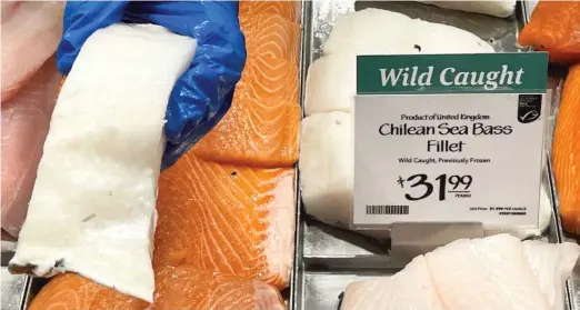  ?? JOSHUA GOODMAN/AP ?? Fillets of Chilean sea bass caught near the U.K.controlled South Georgia island are displayed for sale at a Whole Foods Market in Cleveland, Ohio, on Monday.