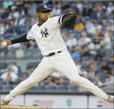  ?? PHOTO/FRANK FRANKLIN II ?? New York Yankees’ Luis Serverino delivers a pitch during the first inning of a baseball game against the Los Angeles Angels on Tuesday, in New York. AP