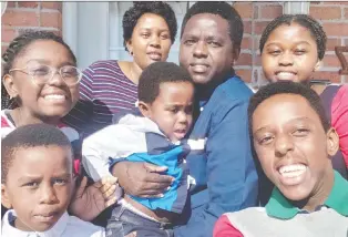  ?? GOFUNDME ?? Amoti Furaha Lusi and Désiré Buna Ivara with their five children in happier times. Furaha Lusi, wearing stripes, a patient attendant, brought home COVID-19. Her entire family fell ill and her husband died on May 20.