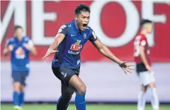  ??  ?? BG Pathum’s Siroch Chatthong celebrates after scoring against Police Tero.