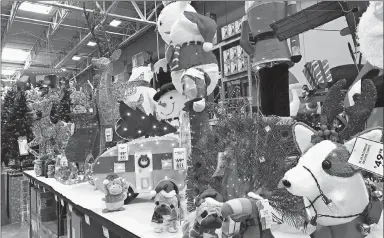  ?? DAVID ZALUBOWSKI/AP ?? A Lowe’s store displays Christmas decoration­s Oct. 2 in Colorado. Retailers are starting the holiday season earlier than ever.