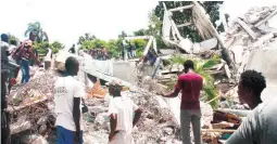  ?? (AFP) ?? GONE - People search through the rubble of what used to be the Manguier Hotel after the earthquake hit on August 14, 2021 in Les Cayes, southwest Haiti. Rescue workers scrambled to find survivors after a powerful 7.2-magnitude earthquake struck Haiti early Saturday, killing at least 304 and toppling buildings in the disaster-plagued Caribbean nation still recovering from a devastatin­g 2010 quake.