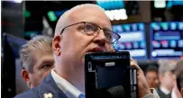  ?? — AP ?? technology companies, banks and industrial stocks led the market slide on wall Street on tuesday.