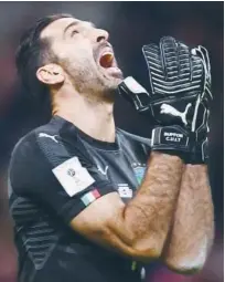  ?? Agence France-presse ?? Italy’s goalkeeper Gianluigi Buffon reacts after losing in their World Cup qualifier against Sweden on Monday.