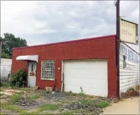  ?? CHAD FELTON — THE NEWS-HERALD ?? Plans to demolish a former auto detailing business are already in the works at 19770 St. Clair Ave. in Euclid. New owners John and Kathy Broadway have expanded their Dellriver Services trucking firm with the recent purchase of the property, which sits next door to their existing operation.