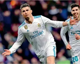  ??  ?? Cristiano Ronaldo of Real Madrid celebrates a goal during their Spanish league match against Girona FC at the Santiago Bernabeu stadium in Madrid on Sunday. Real won 6-3. —