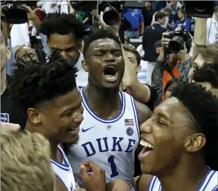 ?? STREETER LECKA — GETTY IMAGES ?? Zion Williamson, center, and the Duke Blue Devils celebrate the program’s 21st ACC title. Williamson, who missed three weeks with a sprained knee, scored 21 points to cap his first weekend back in action.