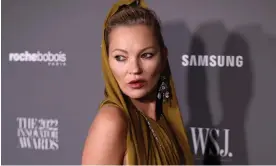  ?? Photograph: Dimitrios Kambouris/Getty Images for WSJ. Magazine Innovators Awards ?? Kate Moss presents an award at the Museum of Modern Art in New York earlier this month wearing a sheer olive-green silk jersey dress whose only warmth came from a builtin hood.