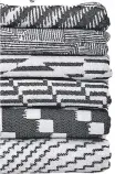  ??  ?? Monochrome jacquard throws in merino lambswool and cotton, 140x195cm, £260 each.