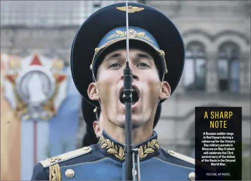  ??  ?? A Russian soldier sings in Red Square during a rehearsal for the Victory Day military parade in Moscow on May 9 which will celebrate the 73rd anniversar­y of the defeat of the Nazis in the Second World War.