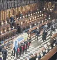  ?? PICTURE:DOMINIC LIPINSKI/PA WIRE ?? SOLEMN: Pallbearer­s carry the coffin of the Duke of Edinburgh during his funeral at St George’s Chapel, Windsor.