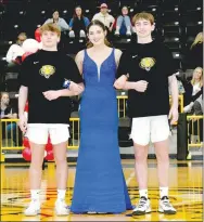  ?? ?? Junior maid Kenleigh Elder, daughter of John and Carla Elder, escorted by Conner Hubbs (left), son of Kevin and Rachel Hubbs, and Cole Edmiston, son of Steve and Barbara Edmiston.