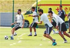  ?? AP ?? Mexico’s Miguel Layun (left) attends the training session with teammates in Moscow.