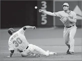  ?? FRANK FRANKLIN II/AP PHOTO ?? Nationals second baseman Daniel Murphy (20) throws to first base after forcing out Michael Conforto of the Mets in the ninth inning of Saturday’s game at New York. The throw was in time to get Yoenis Cespedes for a game-ending double play.